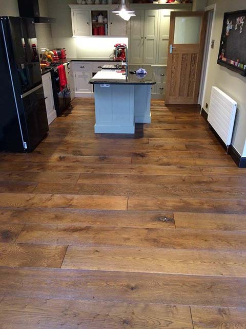 Dark oak hardwood floor in family kitchen